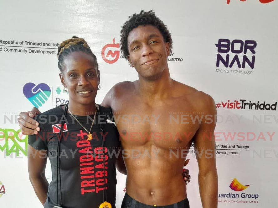 Commonwealth Youth Games gold medallist Nikoli Blackman, right, hugs TT swim coach and former national swimmer Sharntelle McLean after winning 200m free gold at the National Aquatics Centre, Couva, Sunday. - Photo by JONATHAN RAMNANANSINGH (Image obtained at newsday.co.tt)