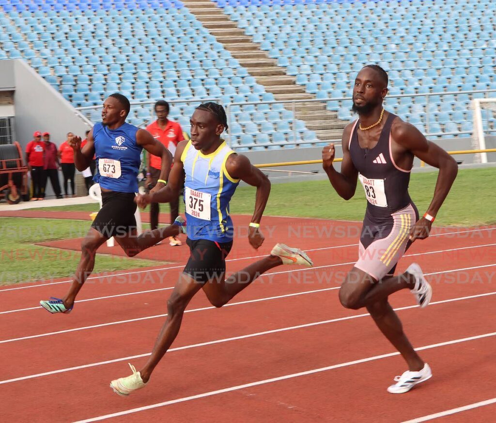 Jereem Richards (r) won his heat in the Men's 400m, at the NAAA senior and junior national championship at the Hasely Crawford Stadium. - Photo by Angelo Marcelle (Image obtained at newsday.co.tt)