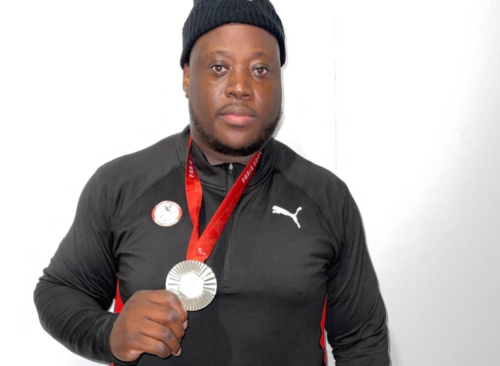 Trinidad and Tobago's Akeem Stewart displays his Paralympic Games men's discus F64 silver medal at the Stade de France on September 5. - Photo courtesy TT Paralympic Committee (Image obtained at newsday.co.tt)