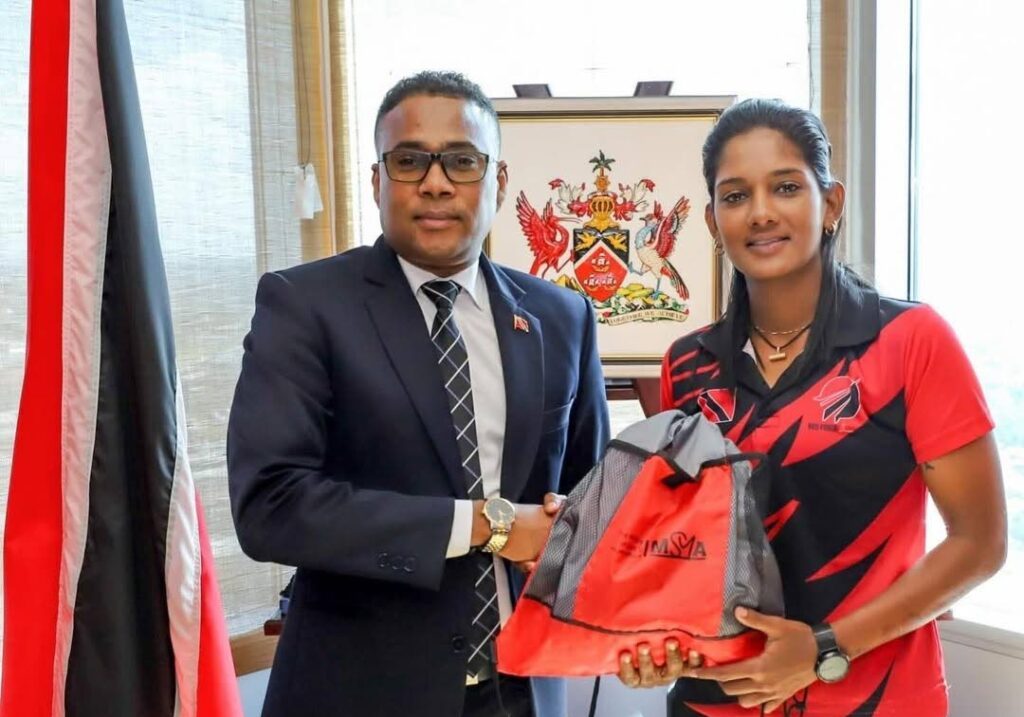 Minister of Sport and Youth Affairs Phillip Watts and TT women's team cricketer Karishma Ramharack. - Photo courtesy Ministry of Sport and Youth Affairs (Image obtained at newsday.co.tt)
